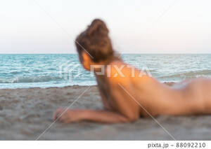 laying naked on beach gallery - Naked woman lying on sandy beach and having... - Stock Photo [88092210] -  PIXTA