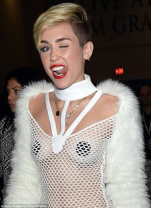 Miley Cyrus Peeing Porn - Miley Cyrus steps out in nipple pasties and fishnet dress at iHeartRadio  Music Festival | Daily Mail Online