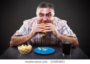 fat people eating like slobs - Portrait of a greedy fat man eating burger on gray background