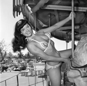 christmas bettie page nude - In this photo taken in 1954 by photographer Bunny Yeager, model Bettie Page  poses on