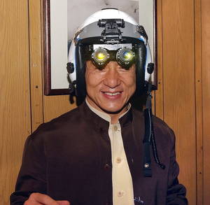 Forbidden Chan Porn - Jackie Chan tries on a fighter pilot's helmet with night vision goggles