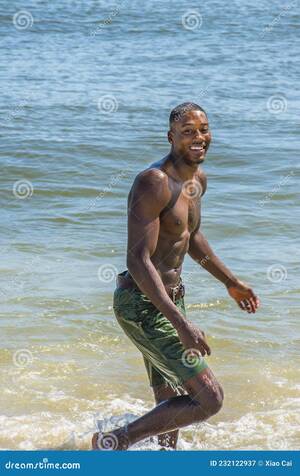 naked beach interracial - Young Black Man, Shirtless, Walking on Beach, Smiling, Looking Around Stock  Image - Image of pecs, black: 232122937