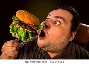 fat people eating like slobs - Diet failure of fat man eating fast food . Happy smile overweight person  who crazy makes