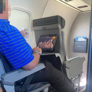 flight - Passenger shamed for watching 'naughty' video on busy flight | The Irish Sun