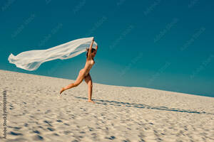 Beach Nudist Mature - Beautiful nude mature woman running on sandy beach in summer Stock Photo |  Adobe Stock