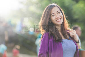 Girl Adolesent Porn - A portrait of a beautiful asian woman smiling brightly at the camera