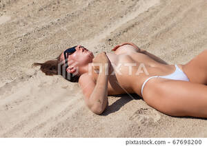 laying naked on beach gallery - Sensual topless woman lying on sandy beach - Stock Photo [67698200] - PIXTA