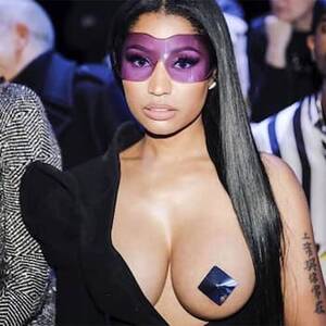 nicki minaj naked boobs - Nicki Minaj takes attention-seeking to another level, exposes breast at  Paris Fashion Week