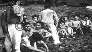 asian war vintage nudes - Military supplies offloaded from Landing Ships and naked natives are taken  prison...HD Stock Footage