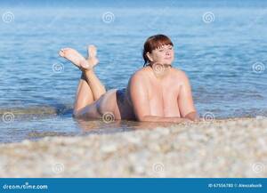 chubby nudist beach topless - Overweight Middle Aged Woman at the Sea Stock Photo - Image of girl, alone:  67556780