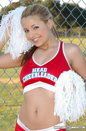 Head Cheerleader Porn - Smiling sweet cheerleader in red uniform flashes her ass and pussy outdoors