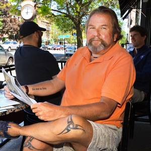 John Milton Porn - John Tighe of Milton sits at a sidewalk cafe in Saratoga Springs Friday,  May 18