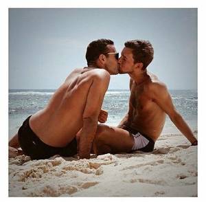 cute people on the beach - beach kiss