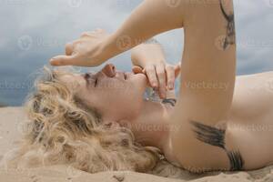 close up beach nudes - Close up naked lady covering eyes from sun on beach portrait picture  17325646 Stock Photo at Vecteezy