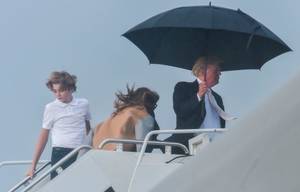 Inside Out Riley Anderson Porn - US President Donald Trump holds an umbrella as he waits for his son Barron  and wife Melania to board Air Force One at Palm Beach International Airport  in ...