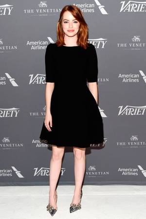 Emma Stone Painful - 12 November Emma Stone looked chic in a simple black dress with grey heels  for a