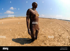 mud beach nude - wideangle nude naked another place iron man anthony gormley crosby beach  liverpool travel tourism art sculpture summer seaside Stock Photo - Alamy