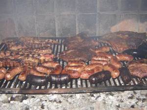 Argentina Outdoor Porn - Traditional meal to share with family and friends in Argentina. And sooooo  good! Asado: meat, sausage, and offal all on an outdoor grill.