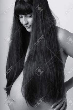 long hair pregnant nude - Beautiful pregnant woman with naked body covered with hair Stock Photo -  15032516