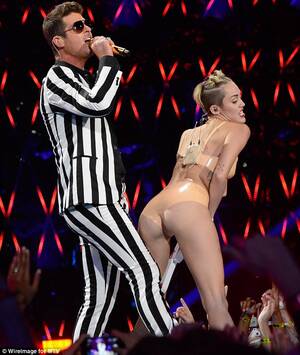 Miley Cyrus Porn Hardcore - MTV VMAs 2013: Miley Cyrus strips to a flesh-coloured two-piece to perform  dance with Robin Thicke | Daily Mail Online