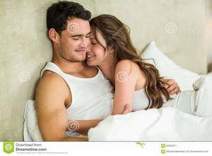 bedroom romantic - Young Couple Cuddling On Bed Stock Photo - Image: 66932530 jpg 1300x957