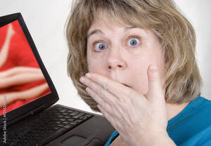 Computer Porn - Internet Porn â€“ A shocked woman sees porn on her laptop computer. Stock  Photo | Adobe Stock