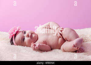 naked plump babes - Cute, pretty, happy and chubby baby girl without clothes, naked or nude,  lying down a fluffy blanket with pink flower headband. Four months old  Stock Photo - Alamy