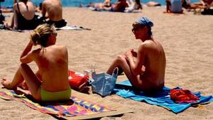 beach topless sunbathing videos - Topless sunbathing defended by French interior minister - BBC News