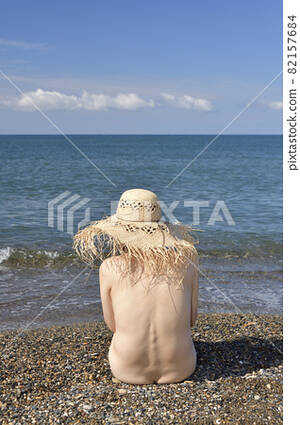 Beach Nudist Mature - Shooting nude women in straw hats on the summer... - Stock Photo [82157684]  - PIXTA