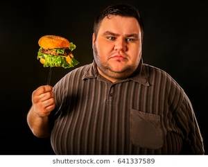 fat people eating like slobs - Diet failure of fat man eating fast food hamberger. Happy smile overweight  person who spoiled