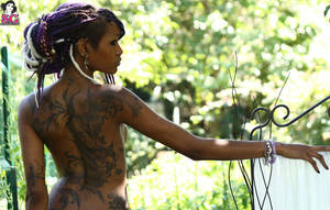 black chick tattoo - Osmoz, from Suicide Girls.