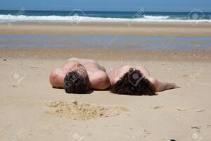 laying naked on beach gallery - Man And Woman Lying Nude On The Beach Stock Photo, Picture and Royalty Free  Image. Image 61320878.