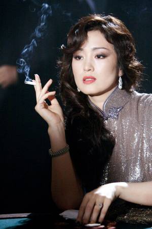 asian celebrity fakes michelle yeoh - Gong Li