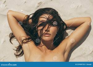 close up beach nudes - Nude Woman Sunbathing on the Nudist Beach Stock Photo - Image of awesome,  brunette: 229989750