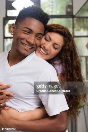 interracial couple laughing - Young Beautiful Interracial Couple Hugging And Laughing High-Res Stock  Photo - Getty Images