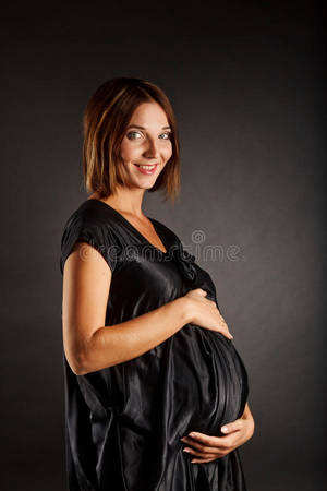 long hair pregnant nude - Download Nude Pregnant Woman In Black Dress Stock Image - Image of pregnant,  naked: