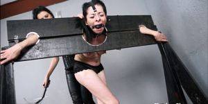 ebony babe gagging - Wooden stock whipping and Latina punishment of lesbian slave girl in south  american bdsm