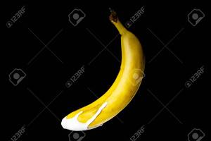 Banana Fruit Porn - Banana With White Icing On The End. Sex, Food Porn, Sexually On A Black  Background Isolate. Copy Space Stock Photo, Picture and Royalty Free Image.  Image 139166890.