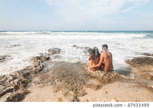 india beach nude - Naked couple sitting on rocky seashore in summer - Stock Photo [87431499] -  PIXTA