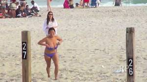 downblouse beach bikini - Girl fights To Keep big boobs Inside bikini top but she lose