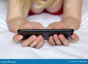 cell phone video - Blonde Woman Watching Video on Smartphone, Girl in Negligee Lying on the  Bed Stock Image - Image of movies, mobile: 145574291