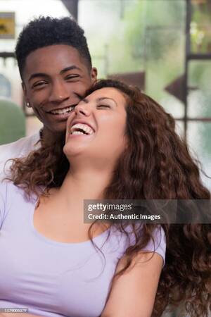 interracial couple laughing - Young Beautiful Interracial Couple Hugging And Laughing High-Res Stock  Photo - Getty Images