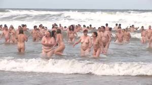 fully naked people on beach - Hundreds of nudist people running into the sea naked | voyeurstyle.com