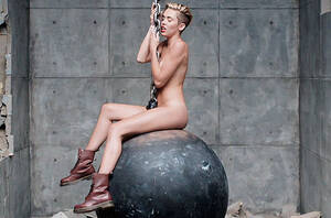 Miley Cyrus Tits Sexy - Miley Cyrus Strips, Swings Around Naked in 'Wrecking Ball' Video: Watch