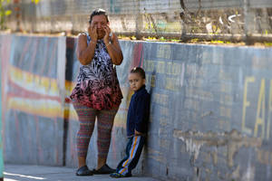 Middle School Student Porn - Mother Elizabeth Acevedo and her son Andres, 3, wait for news of her son  Jose an eight-grader student at the Belmont High School in Los Angeles  Thursday, ...