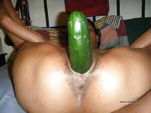 cucumber pussy black - Her black pussy is filled with a huge cucumber. Full-size image #5