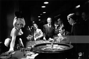 black chick gambling - A bunny girl croupier at the London Playboy club supervises a roulette  wheel. December 20