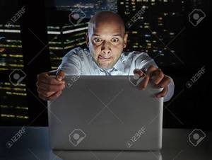 black background porn - addict businessman alone at night sitting at office computer laptop  watching porn or online gambling isolated