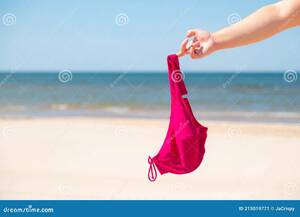 close up beach nudes - Close Up of Young Woman Taking Off Her Bra at Nude Beach. Concept of  Sunbathing Naked on the Sandy Ocean Beach Stock Image - Image of bare,  beautiful: 215019771