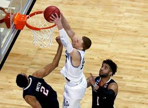 Amarillo Texas Stars - Villanova's Donte DiVincenzo, center, dunks between Texas Tech's Zhaire  Smith, left, and Brandone Francis during the second half of an NCAA men's  college ...